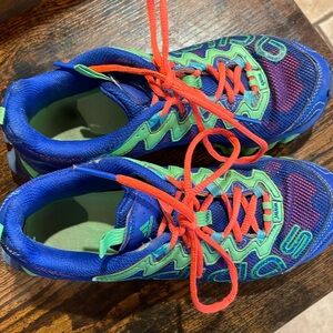 Bright colored adidas trail running shoes. Never ran on trail with them